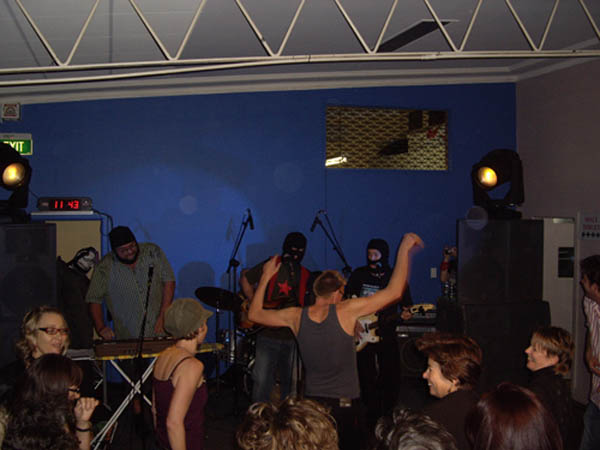 People dancing to the Black Assassins at the Jets Sports ClubClub